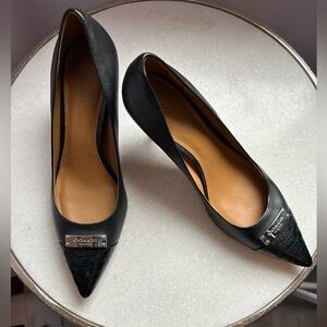 Coach black pumps with snakeskin and Coach insignia detail, size 7.5B